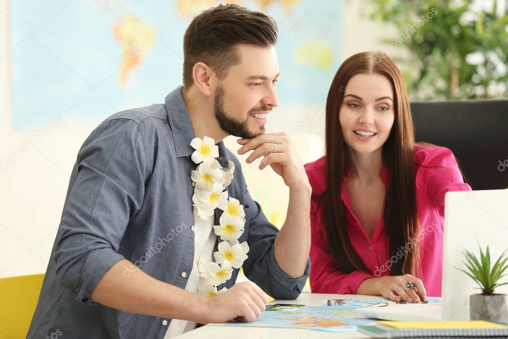 Young man visiting travel agency