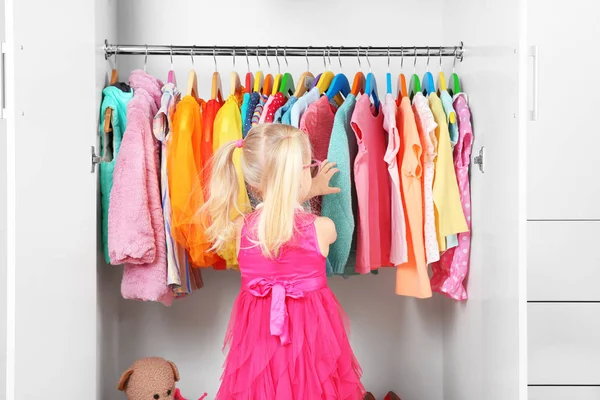 Cute girl in wardrobe — Stock Photo, Image