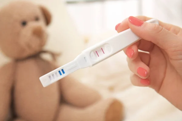 Pregnancy test in female hand — Stock Photo, Image