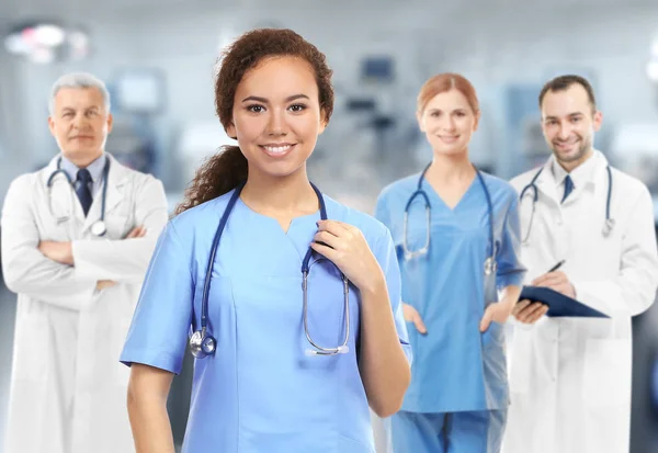 Medical staff on blurred hospital background — Stock Photo, Image