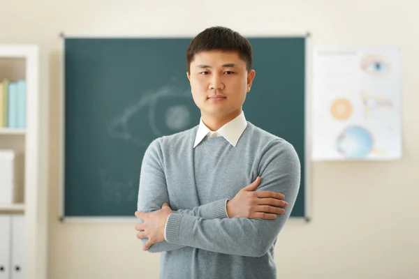 Handsome Asian teacher — Stock Photo, Image