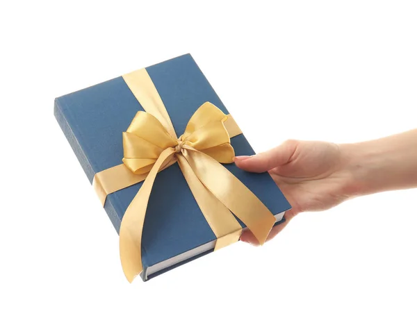 Woman holding book with ribbon as gift — Stock Photo, Image