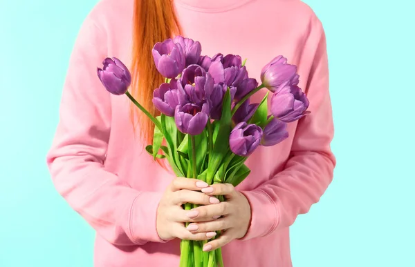 Young woman with beautiful lilac tulips — Stock Photo, Image