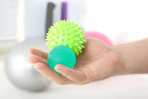 Male hand with stress balls