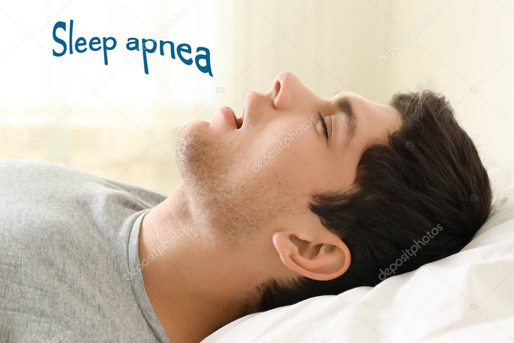 Obstructive sleep apnea concept. Young man snoring while sleeping