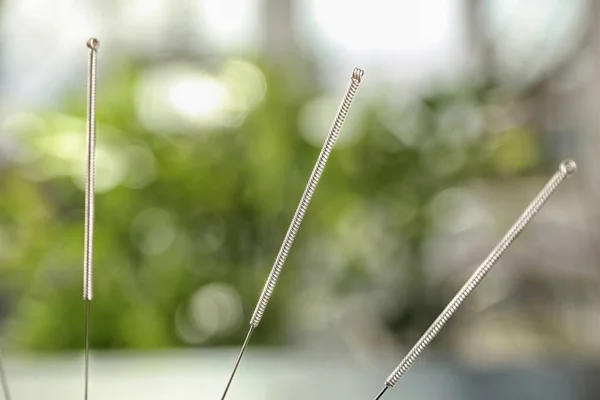 Needles for acupuncture on blurred — Stock Photo, Image