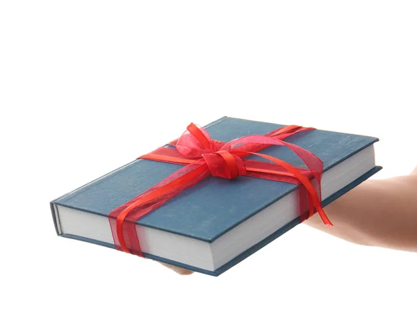 Woman holding book with ribbon — Stock Photo, Image