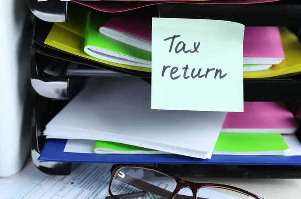 Note with TAX RETURN text — Stock Photo, Image
