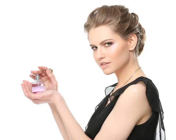Mujer joven con botella de perfume — Foto de Stock