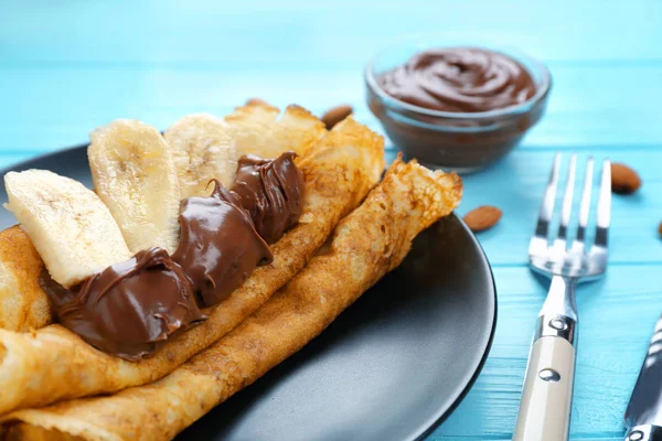 Pancakes with chocolate and banana — Stock Photo, Image