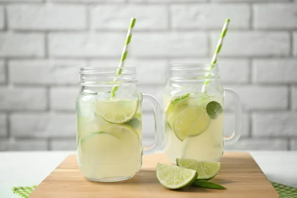 Glass jars of bracing cocktail — Stock Photo, Image