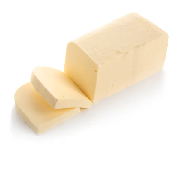 Stück Butter auf Weiß — Stockfoto