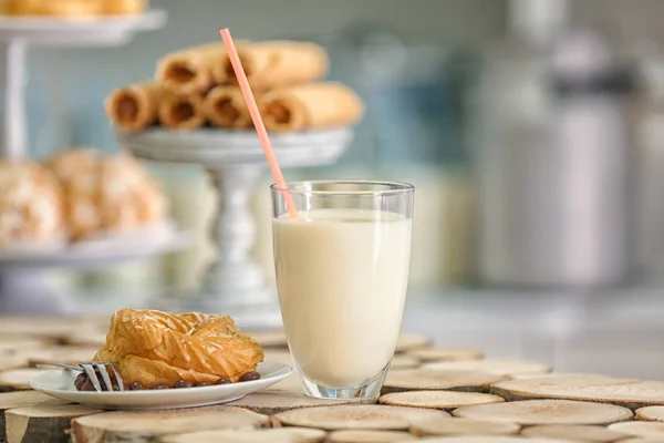 Plate with dessert and glass of milk — Stock Photo, Image