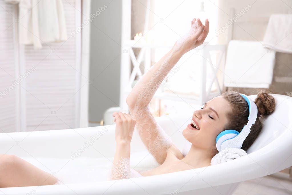 young woman taking bath 