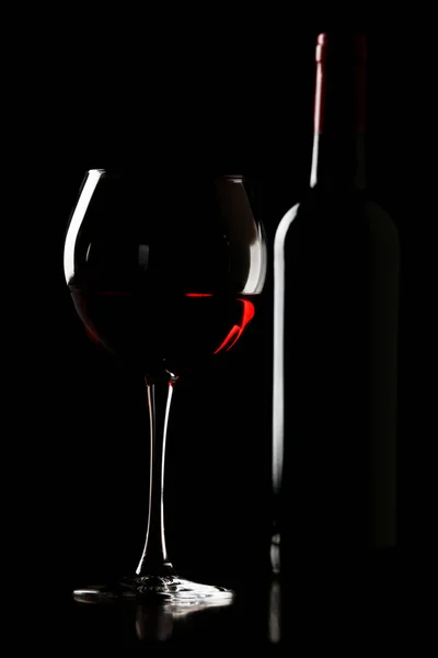 Glass of wine with bottle — Stock Photo, Image