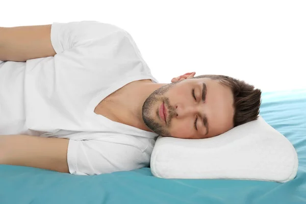 Man sleeping on bed with orthopedic pillow — Stock Photo, Image