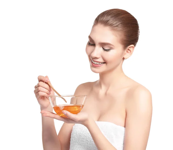 Beautiful young woman with sugaring paste — Stock Photo, Image