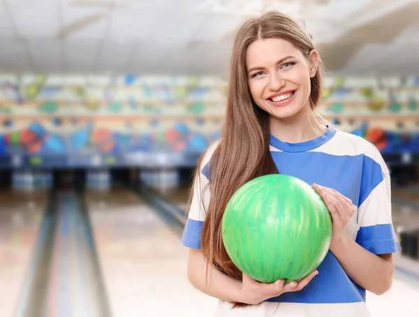 Beautiful young woman with ball — Stock Photo, Image