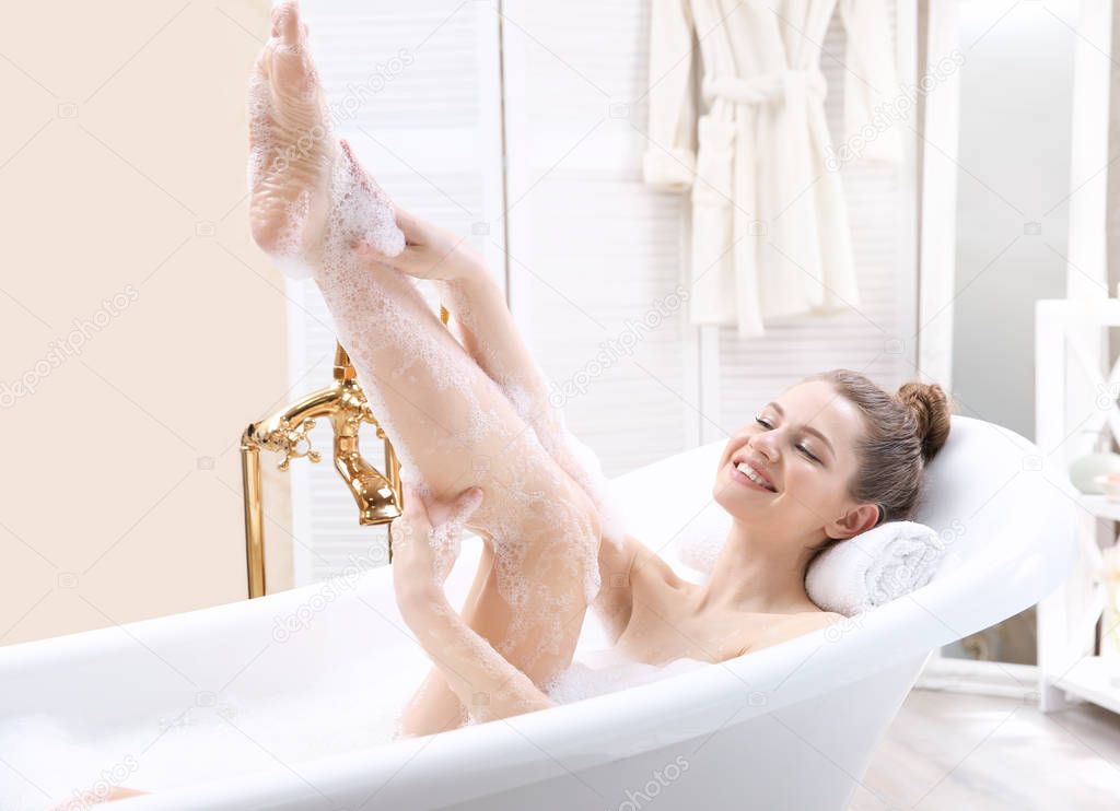 young woman taking bath 