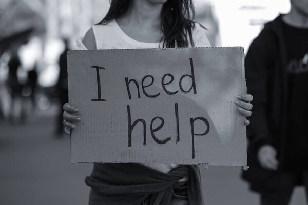 Poor woman begging for help 