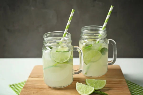 Glass jars of bracing cocktail — Stock Photo, Image