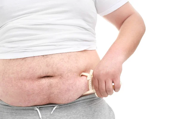 Hombre gordo con pinza de medición — Foto de Stock