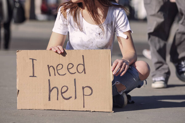 Poor woman begging for help 