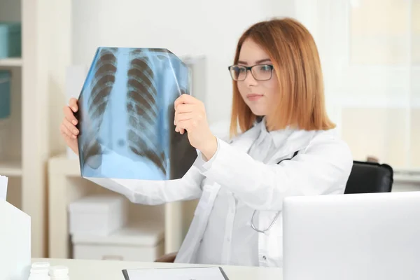 Beautiful young orthopedist working in office — Stock Photo, Image