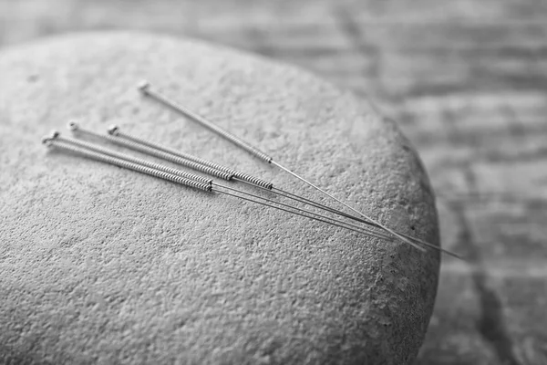 Stone and needles for acupuncture — Stock Photo, Image
