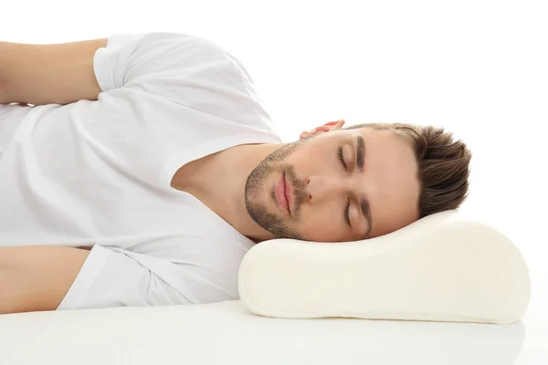 Man sleeping on bed with orthopedic pillow — Stock Photo, Image