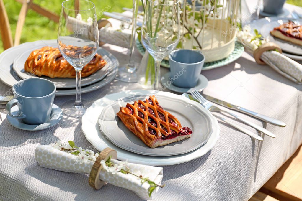 Plates with pie on served table