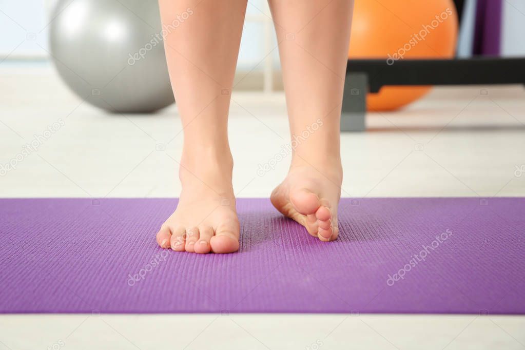 Feet of woman doing exercises 