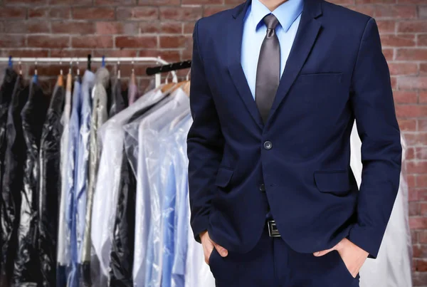 Dry cleaning concept. Businessman on blurred background — Stock Photo, Image