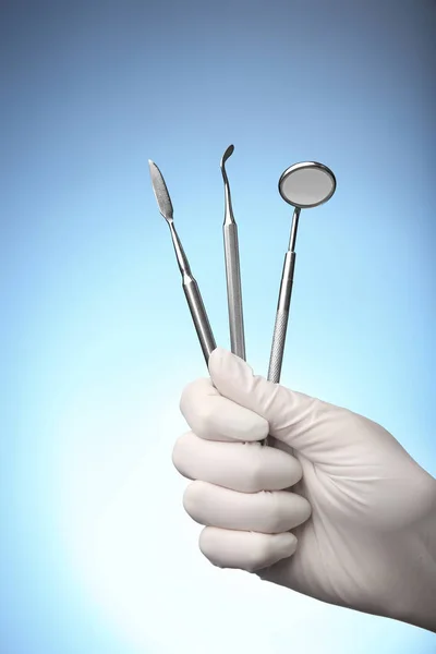 Hand holding dental equipment — Stock Photo, Image