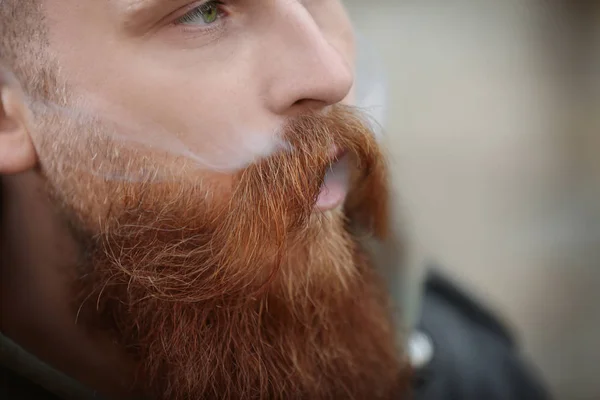 Bearded man smoking weed