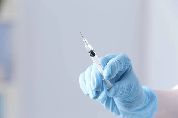 Hand of doctor with syringe — Stock Photo, Image