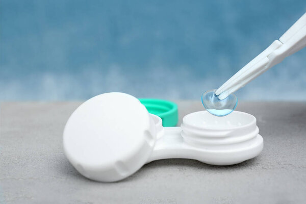 Tweezers with contact lens and case