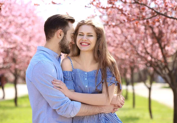 Young couple walking in park — Stock Photo, Image