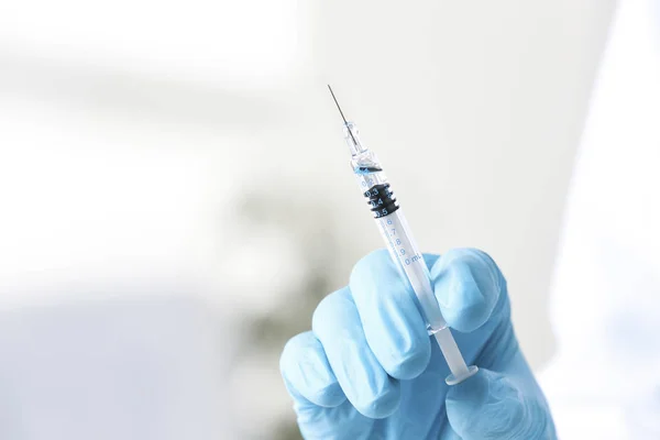 Hand of doctor with syringe — Stock Photo, Image