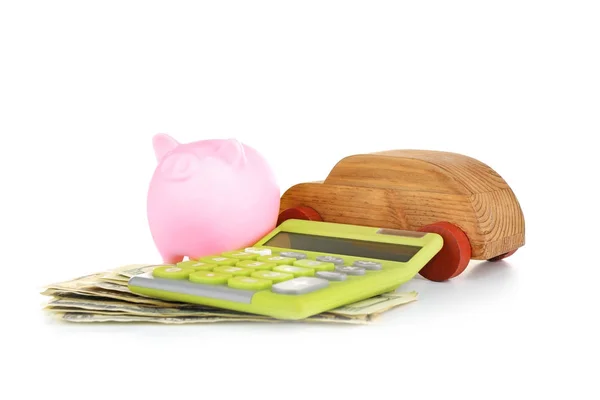 Piggy bank, rekenmachine en speelgoedauto — Stockfoto