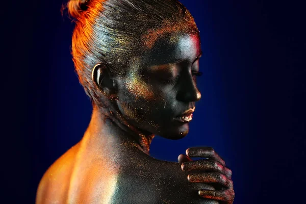 Woman with dark paint and sparkles on body — Stock Photo, Image