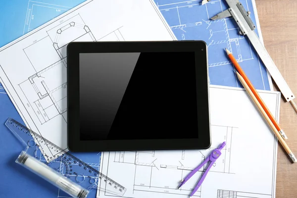 Engineering supplies, tablet and blueprints — Stock Photo, Image