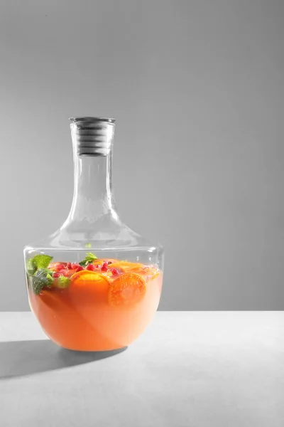 Decanter of fresh cocktail with pomegranate — Stock Photo, Image