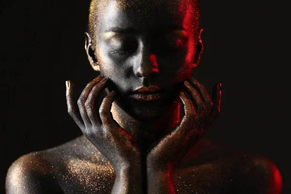 Woman with dark paint and sparkles on body — Stock Photo, Image