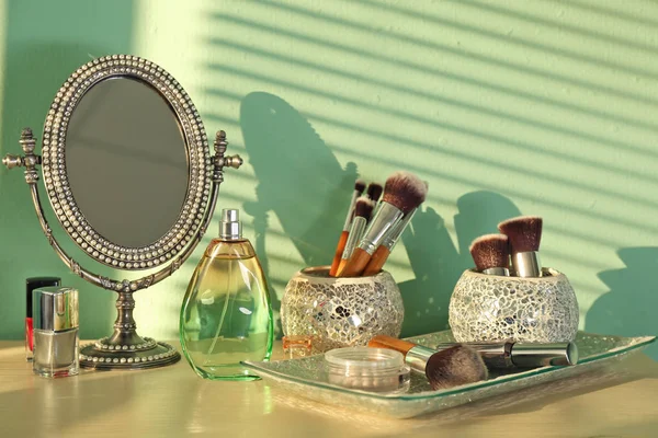 Decorated mirror and cosmetics — Stock Photo, Image