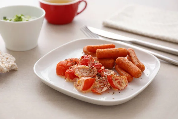 Plate with fried carrot and tomatoes — Stock Photo, Image