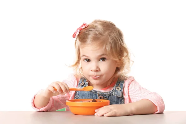 Little girl eating yogurt — Stock Photo, Image