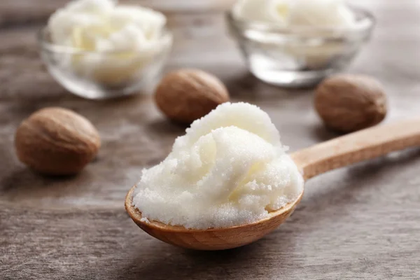 Shea butter in spoon and bowls — Stock Photo, Image