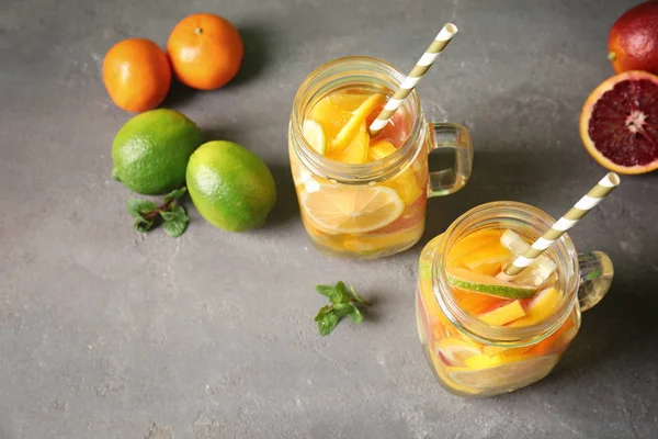 Glass mugs with refreshing citrus cocktail — Stock Photo, Image