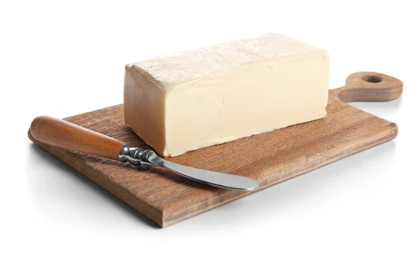 Styrelsen med smör på vit — Stockfoto